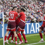 Remo Freuler of Switzerland celebrates his goal against Italy at UEFA Euro 2024, highlighting Switzerland's strong performance in the Germany-hosted tournament.