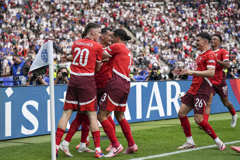 Remo Freuler of Switzerland celebrates his goal against Italy at UEFA Euro 2024, highlighting Switzerland's strong performance in the Germany-hosted tournament.