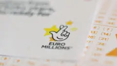 EuroMillions lottery tickets displayed, representing the £83 million jackpot win in the UK.