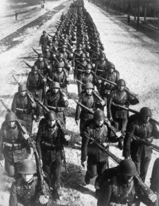 Polish army marching in 1939, illustrating the historical backdrop of conflict that influenced Euro game design