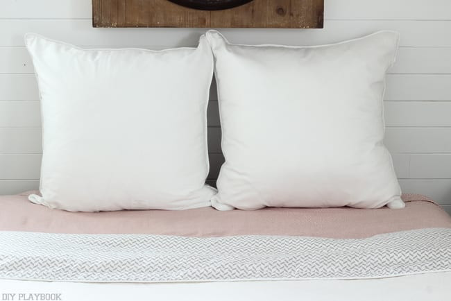 finished euro sham pillow arrangement on a bed