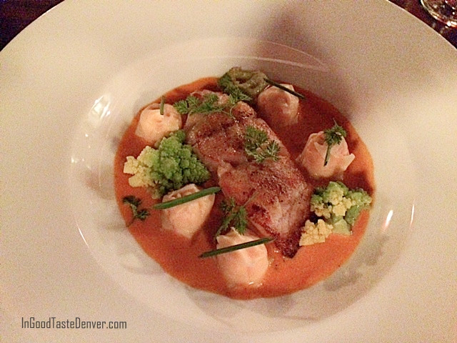 Pan-seared grouper with lobster dumplings and romanesco broccoli, highlighting the refined seafood entrees at Red Square Euro Bistro Denver