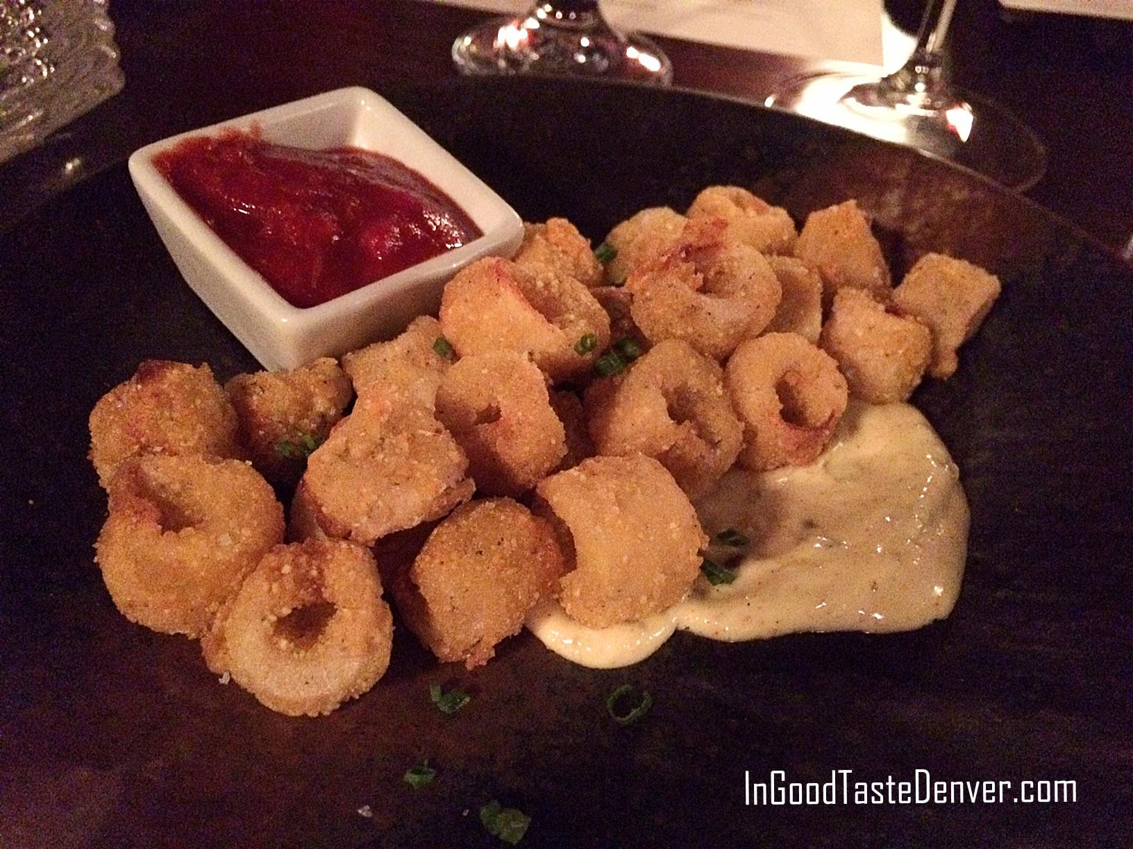 Hearts of palm prepared like calamari with lemon-caper aioli and cocktail sauce, highlighting the creative seafood-inspired dishes at Red Square Euro Bistro Denver