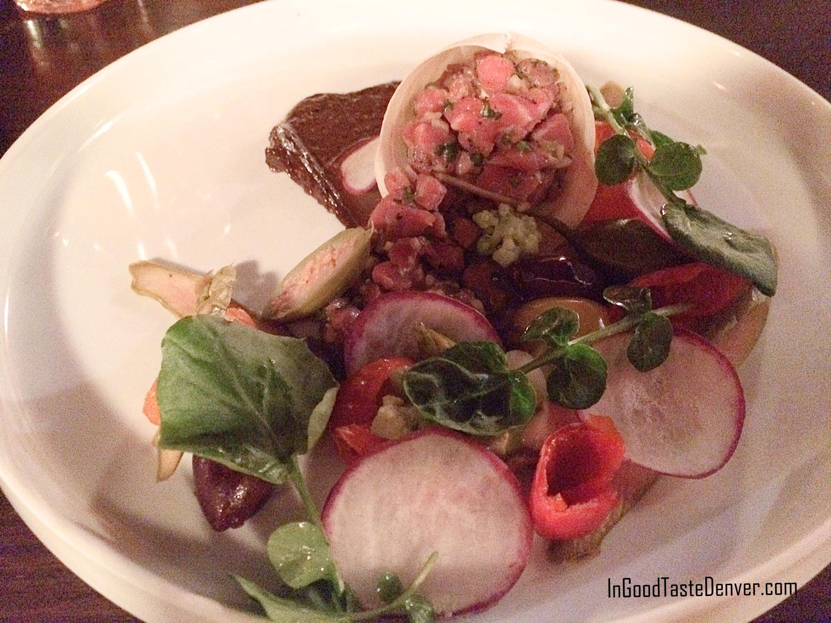 Steak Tartare with black garlic aioli and quail egg, showcasing the surprising and flavorful appetizer options at Red Square Euro Bistro Denver
