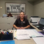 Tony Magliolo, Owner of Euro Auto Body, standing proudly in his shop