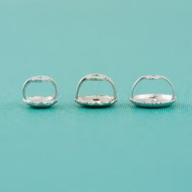 A group of 3 threaded earring backs side view